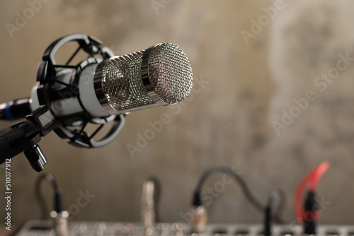 Radio station microphone near sound mixer. Music concept with record studio © Svitlana