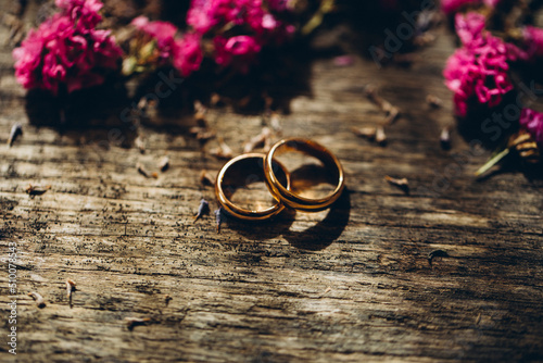 wedding rings and flowers