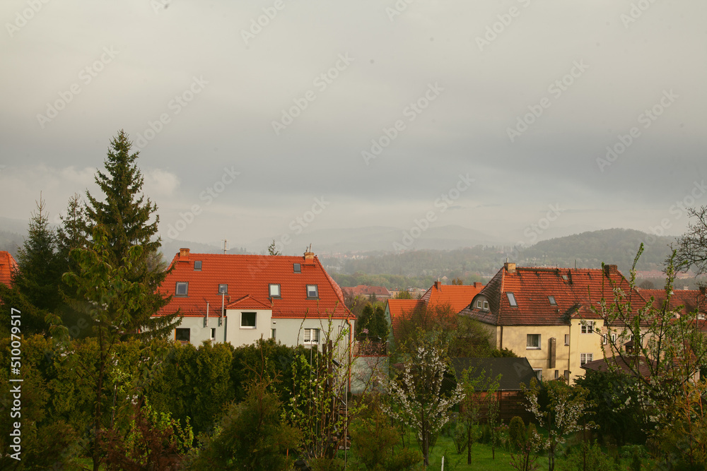 Old European houses with a tiled roof. City in the mountains. Beautiful cityscape