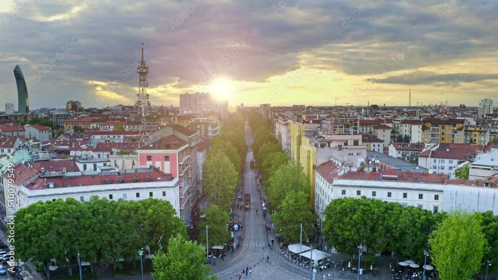 Milano city aerial view from flying drone sunny beautiful sights urban plaza Arco della pace triumphal classical arch imperial monument construction located in Italia historical round square park area