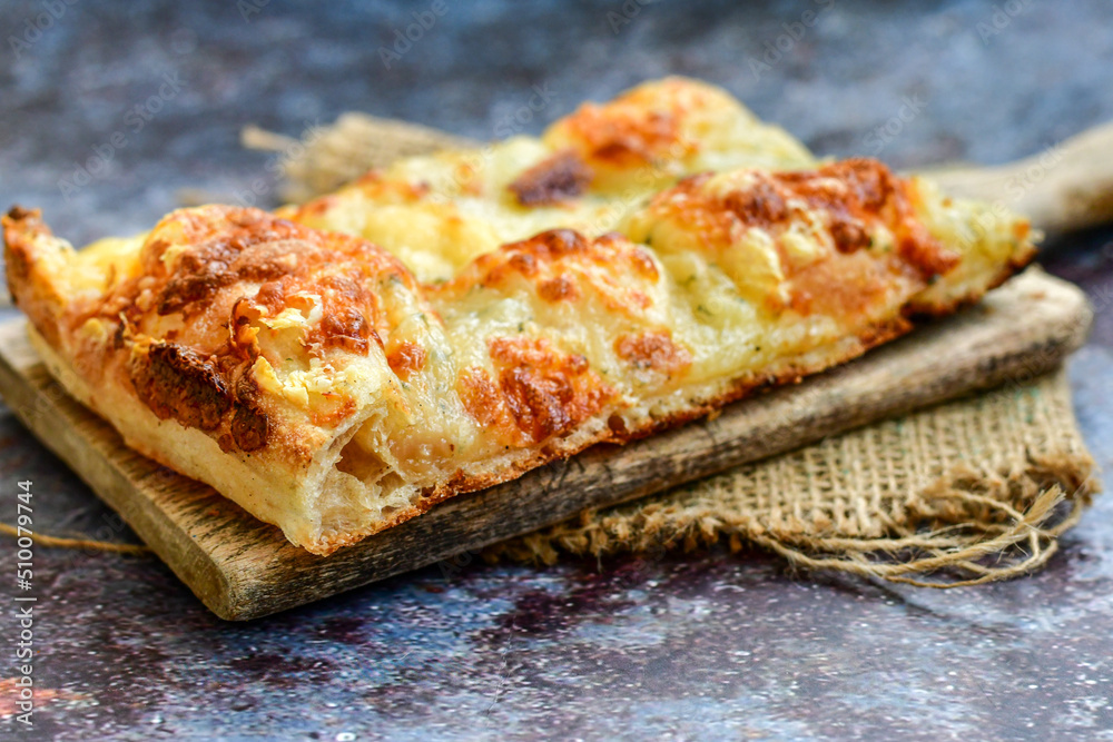 Italian Focaccia four cheese with crispy crust Full 72 hour pizza dough fermentation method. Roman style pizza slice Italian Focaccia four cheese with crispy crust Full 72 hour pizza dough fermentation method. Roman style pizza slice