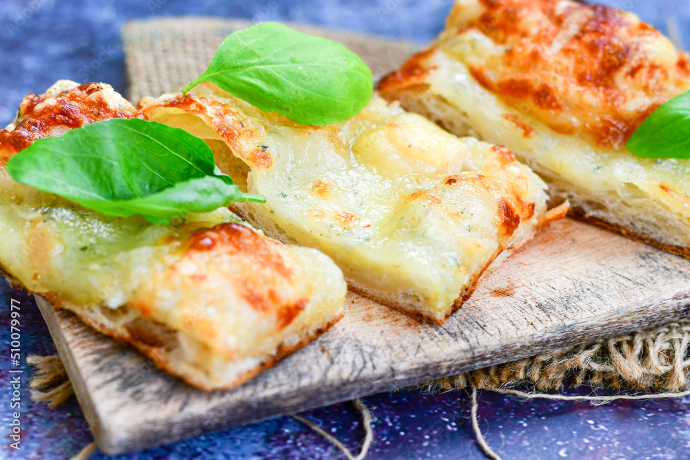 Italian Focaccia four cheese with crispy crust Full 72 hour pizza dough fermentation method. Roman style pizza slice Italian Focaccia four cheese with crispy crust Full 72 hour pizza dough fermentation method. Roman style pizza slice