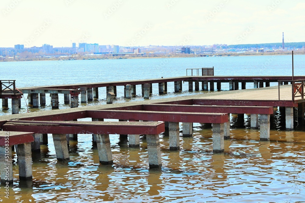 An old, empty pier on the lake