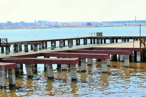 An old, empty pier on the lake © Ruslan