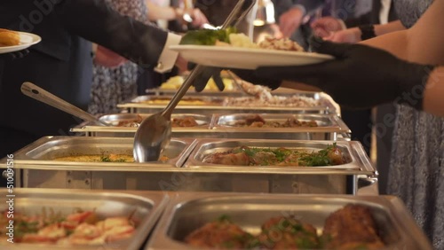 cooking. the waiter, in protective gloves , opens containers with meals