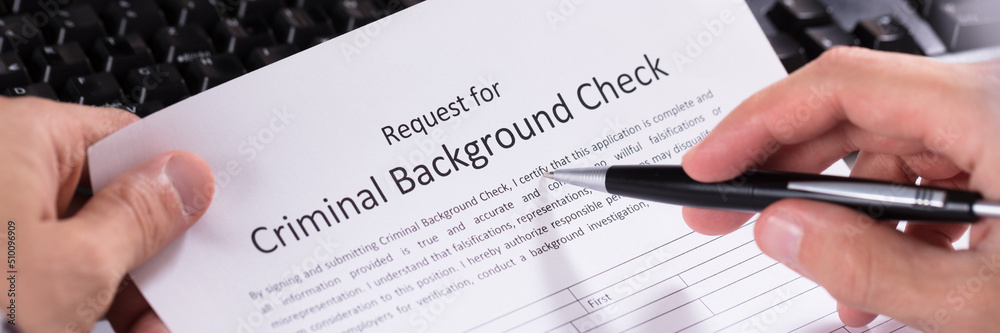 Person Hand Filling Criminal Background Check Application Form Person Hand Filling Criminal Background Check Application Form