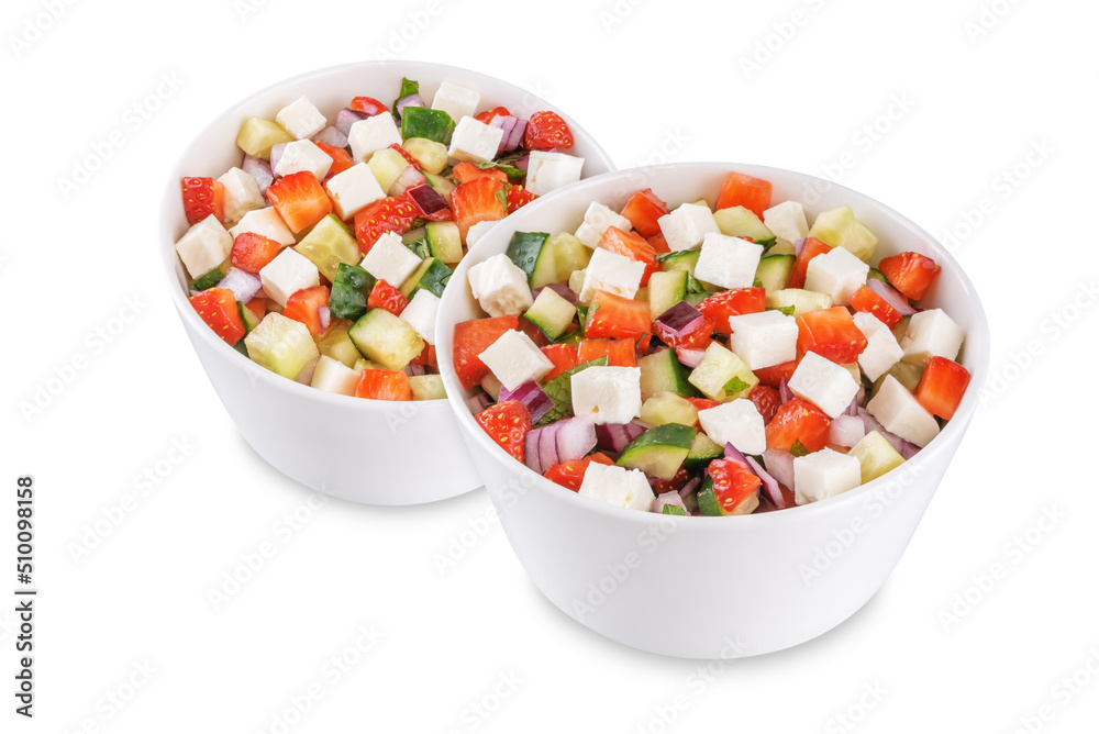 Strawberry Feta cucumber salad in a bowl on a white isolated background Strawberry Feta cucumber salad in a bowl on a white isolated background