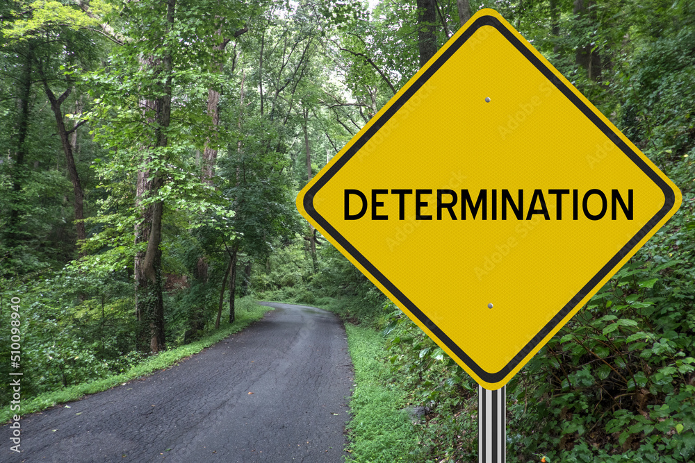 Determination word written for inspirational motivation concept. Determination word written for inspirational motivation concept.