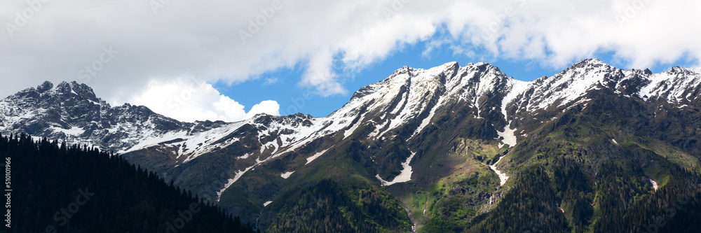 A high mountain on a blue sky background A high mountain on a blue sky background