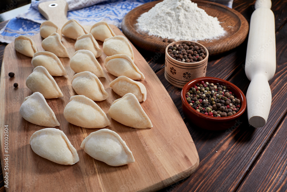 raw dumplings on the wooden board raw dumplings on the wooden board