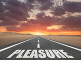 The word Pleasure on a road leading to the horizon with a colorful sky.