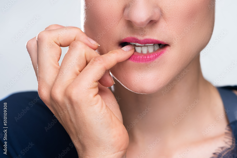 Businesswoman Biting Her Fingernail