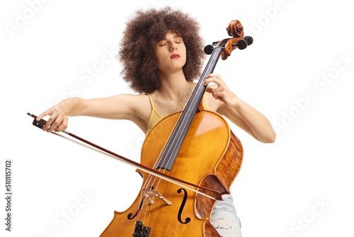 Foto Young female artist sitting and playing a cello