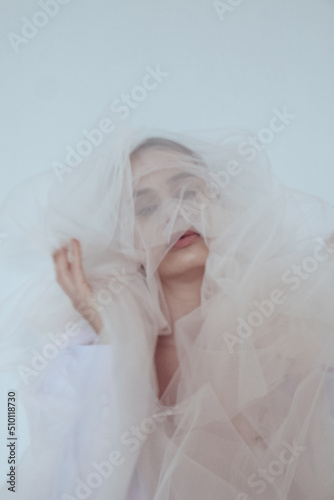 portraits of a girl in a white veil