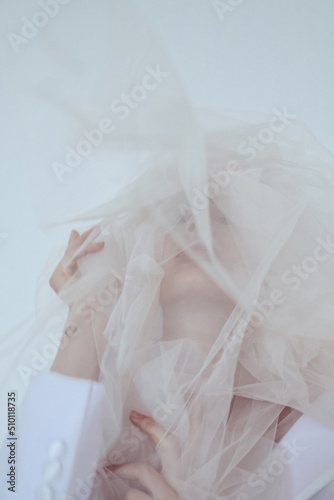 portraits of a girl in a white veil photo