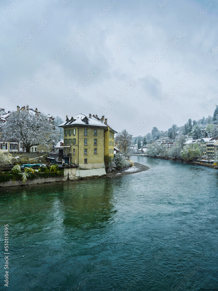 Swiss capital city Bern on River Aare during snowfall, Switzerland