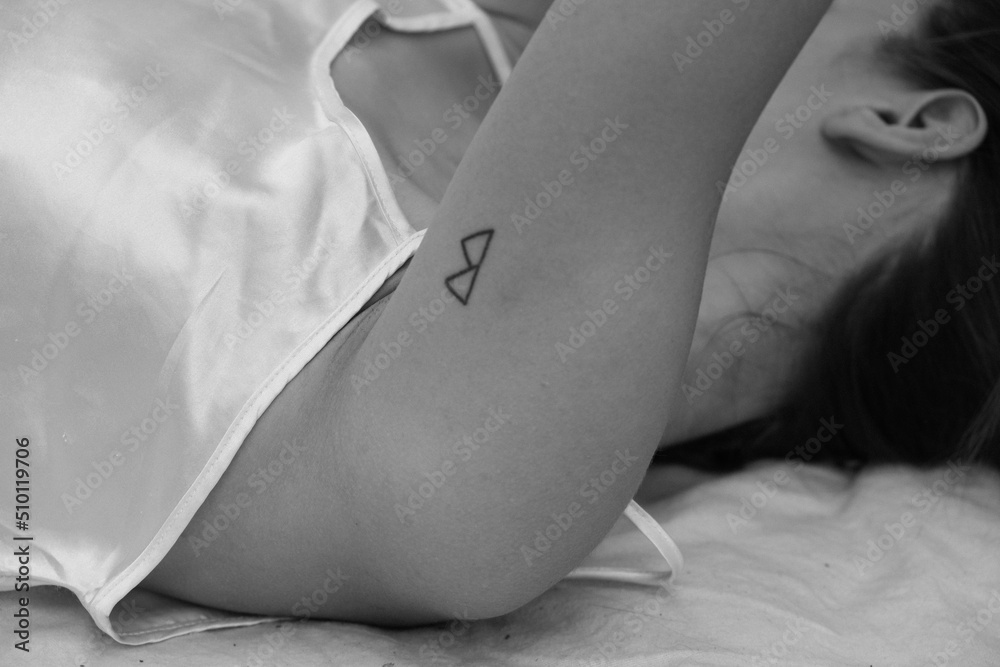 The girl is lying in her underwear . the details of the hands and neck The girl is lying in her underwear . the details of the hands and neck