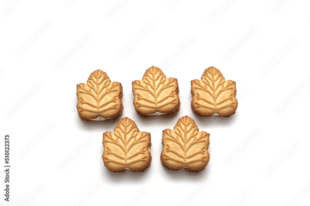 Delicious cookies filled with vanilla cream made with honey or maple syrup from Canadian trees, the traditional sweet of Canada on a white background Delicious cookies filled with vanilla cream made with honey or maple syrup from Canadian trees, the traditional sweet of Canada on a white background