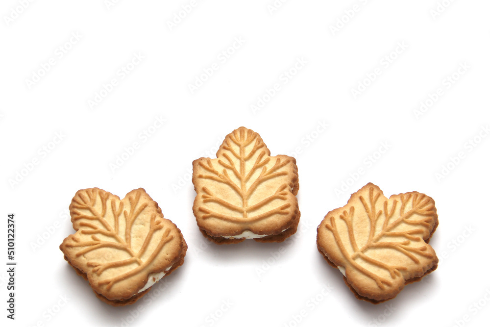 Delicious cookies filled with vanilla cream made with honey or maple syrup from Canadian trees, the traditional sweet of Canada on a white background Delicious cookies filled with vanilla cream made with honey or maple syrup from Canadian trees, the traditional sweet of Canada on a white background