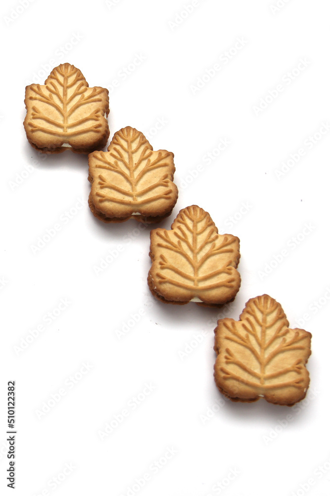 Delicious cookies filled with vanilla cream made with honey or maple syrup from Canadian trees, the traditional sweet of Canada on a white background Delicious cookies filled with vanilla cream made with honey or maple syrup from Canadian trees, the traditional sweet of Canada on a white background