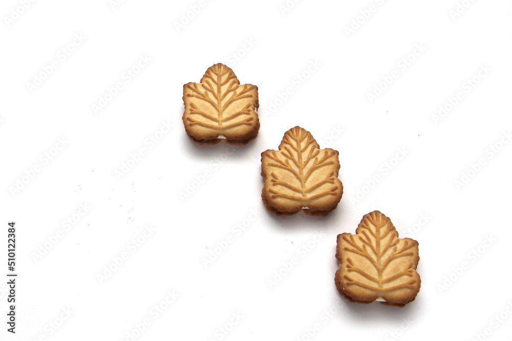 Delicious cookies filled with vanilla cream made with honey or maple syrup from Canadian trees, the traditional sweet of Canada on a white background Delicious cookies filled with vanilla cream made with honey or maple syrup from Canadian trees, the traditional sweet of Canada on a white background