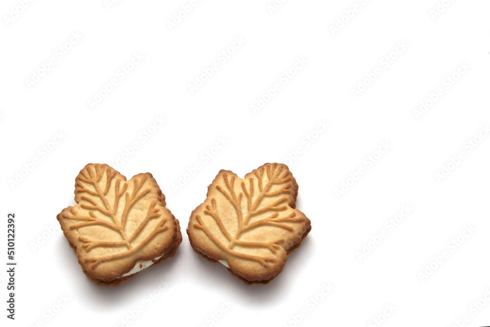 Delicious cookies filled with vanilla cream made with honey or maple syrup from Canadian trees, the traditional sweet of Canada on a white background Delicious cookies filled with vanilla cream made with honey or maple syrup from Canadian trees, the traditional sweet of Canada on a white background