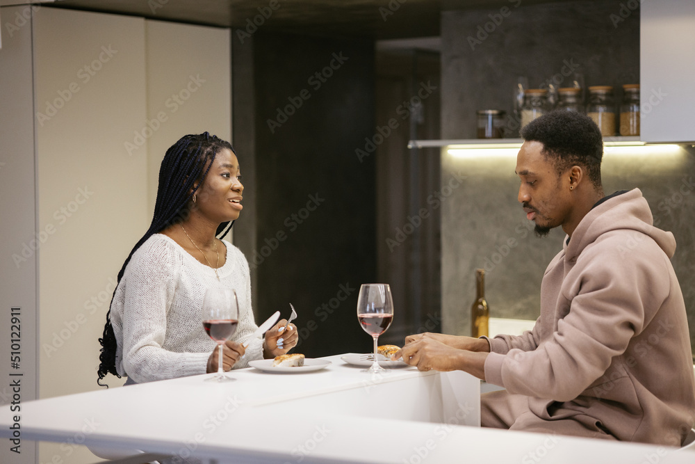 Female having healthy dinner with partner Female having healthy dinner with partner