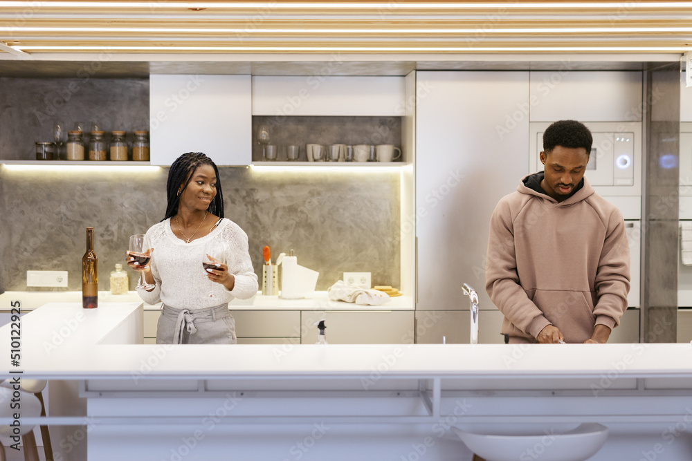 Romantic couple preparing lunch with wine Romantic couple preparing lunch with wine
