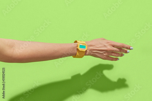 Close up of female hand with papercraft retro watch