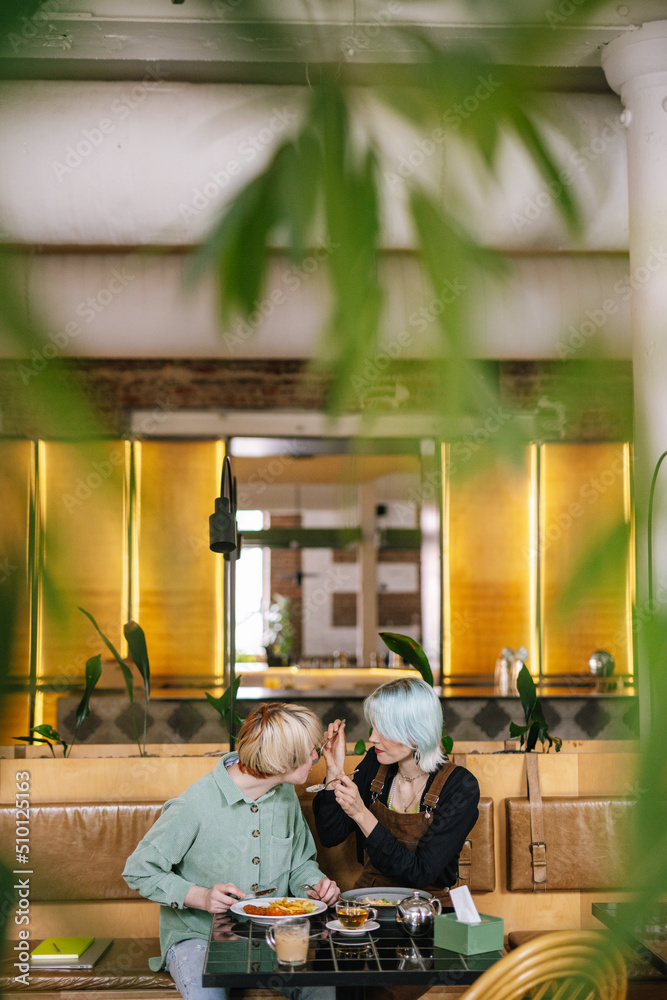 Woman sharing meal with beloved person Woman sharing meal with beloved person