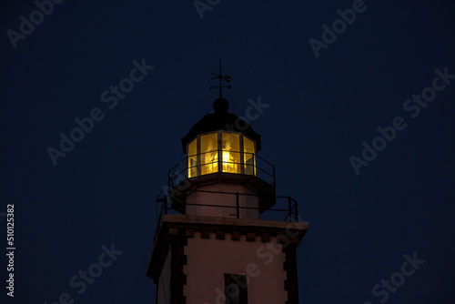 The head of lighthouse at night.