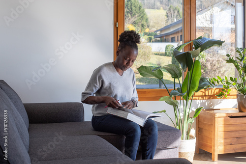 education, woman reading big book at home, search information photo