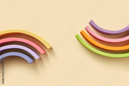 Curved wooden hemispheres of on beige background photo