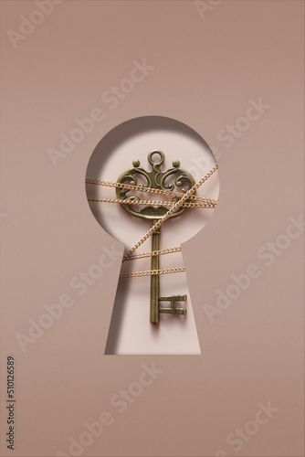 Vintage key with chain inside paper made keyhole photo