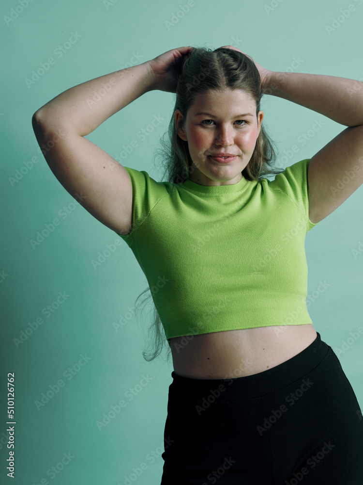 A empower blonde woman portrait with her hands up A empower blonde woman portrait with her hands up