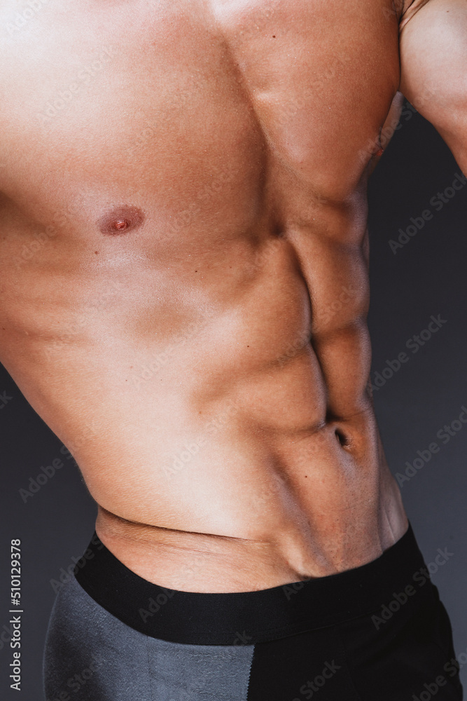 Muscular male torso with abs muscles on body Muscular male torso with abs muscles on body