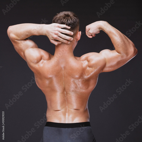 Back double biceps of strong man photo