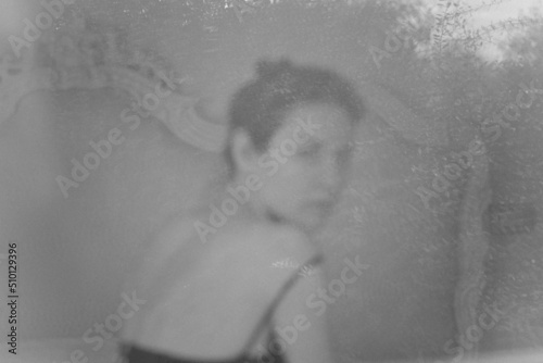 A pensive woman in bed