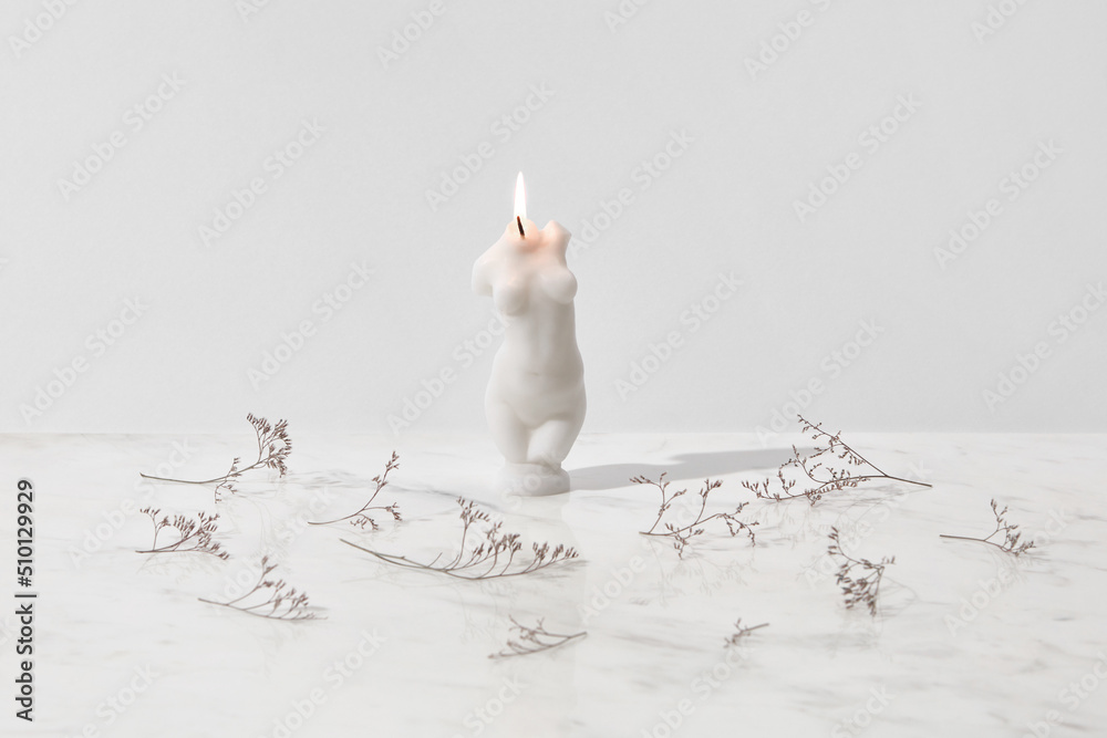 Burning candle in shape of naked female body Stock Photo Adobe Stock