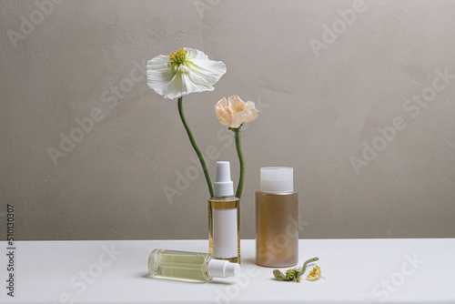 Still life of skincare/haircare product with poppies photo
