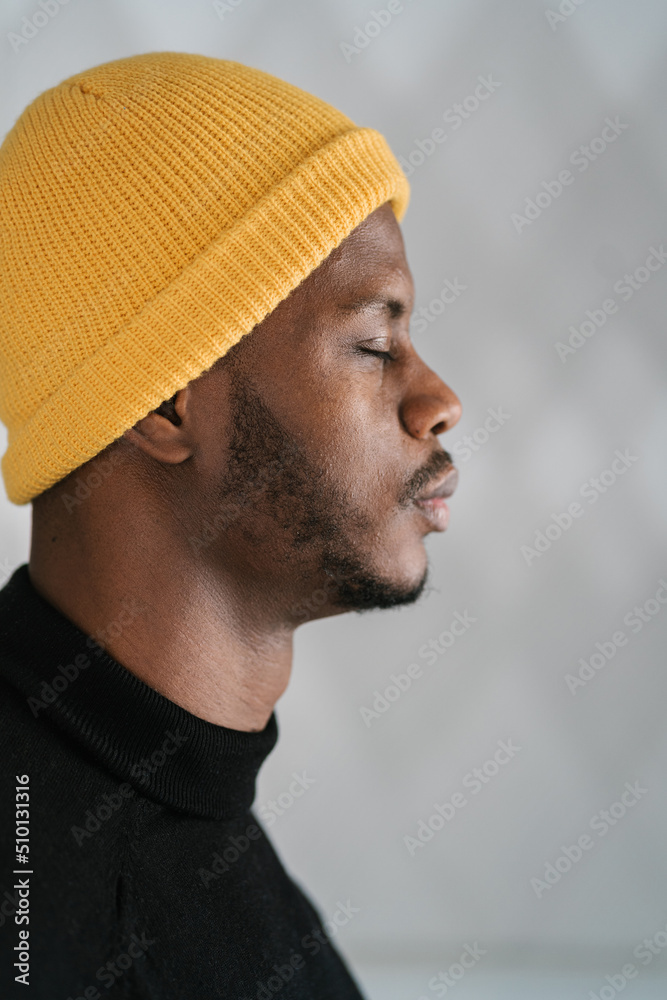 Calm African American male closing eyes Calm African American male closing eyes