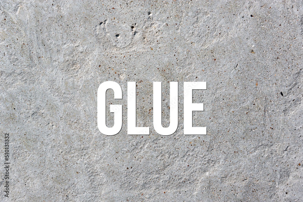 GLUE - word on concrete background. Cement floor, wall. GLUE - word on concrete background. Cement floor, wall.