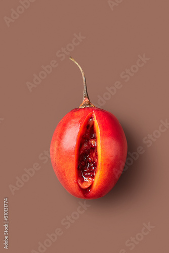 Cut juicy tamarillo fruit photo