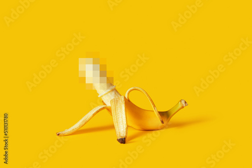 Censored peeled banana with condom