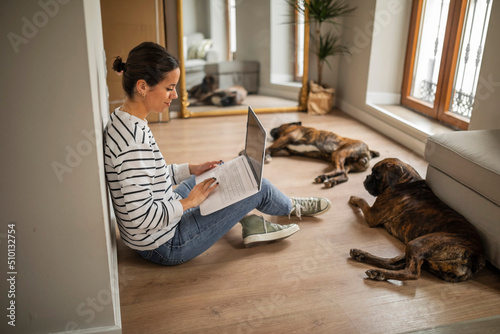 Young woman with a laptop at home photo