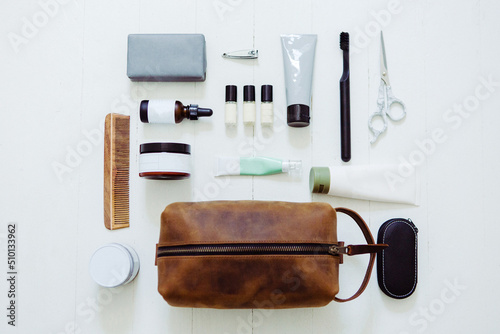 Men's Leather Toiletry Cosmetic Bag with Self Care Products Flatlay photo