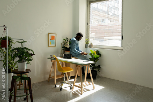 Black man working at modern office