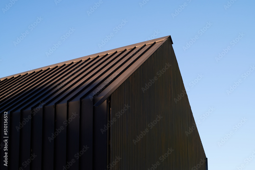 Pitched roof of modern barn style property Pitched roof of modern barn style property