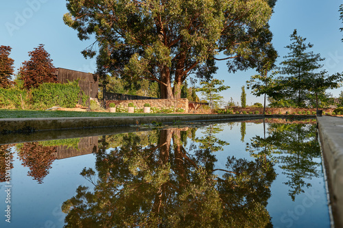 Landscaped garden with modern moat as water feature photo