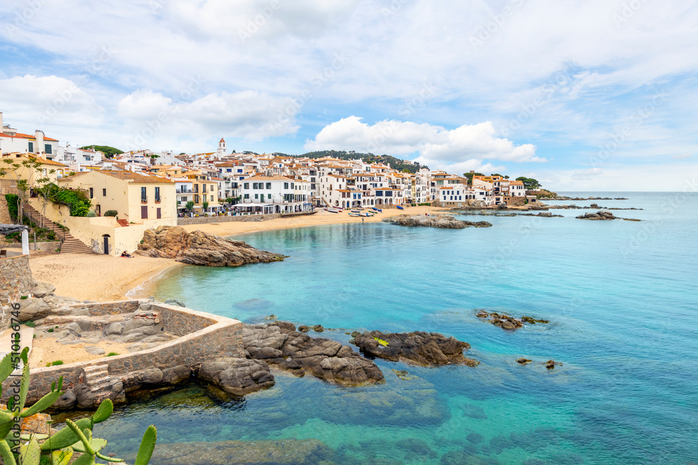 The whitewashed fishing village of Calella de Palafrugel near Barcelona on the Costa Brava coast of Southern Spain, with it's rocky coastline, bay and small town.

